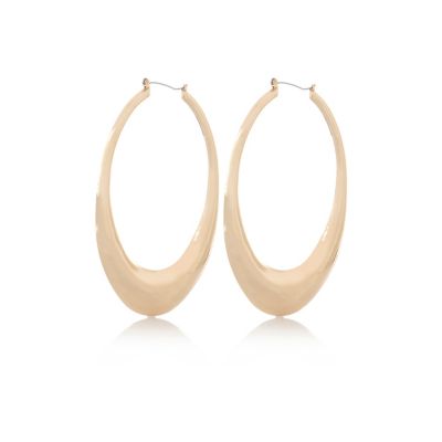 Gold tone oversized oval hoop earrings
