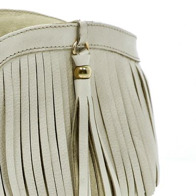 White leather fringed ankle boots