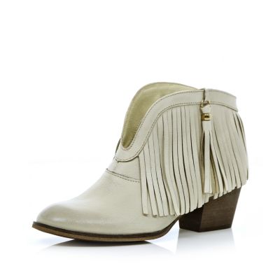 White leather fringed ankle boots