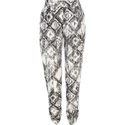 Black and white tribal print trousers
