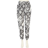 Black and white tribal print trousers