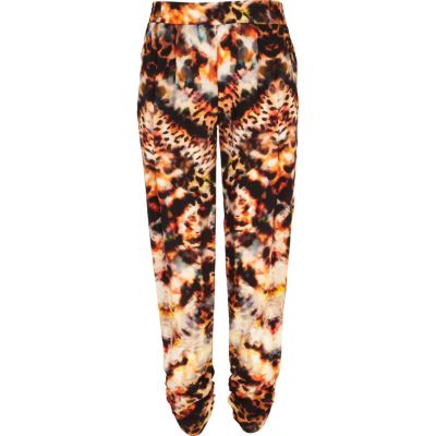 Orange animal print tapered trousers