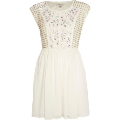 Cream embellished panel skater dress