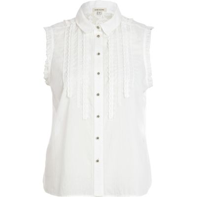 White crochet back frilly sleeveless shirt