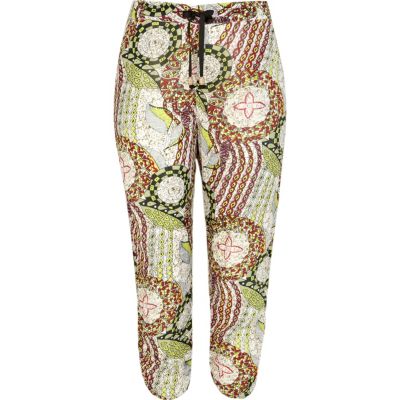 Green tribal print ruched hem crop trousers