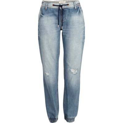 Mid wash distressed jogger jeans