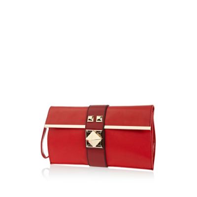 Red pyramid stud twist lock clutch bag 