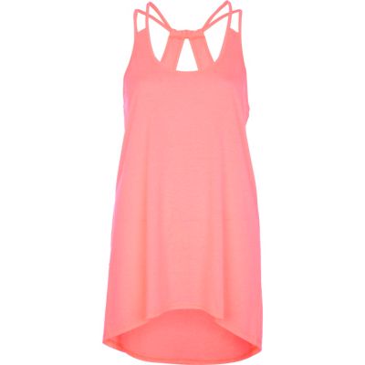 Bright pink cut out dip hem cami top