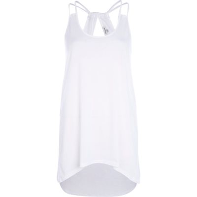 Cream cut out dip hem cami top