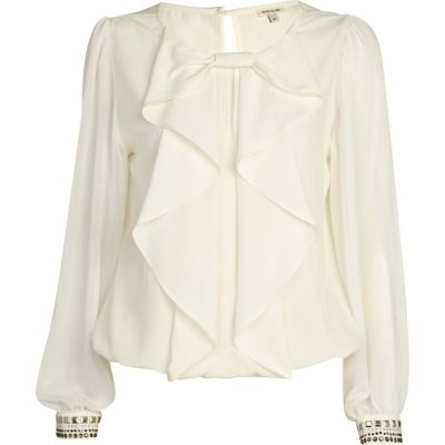 Cream frilly bow bubble hem top