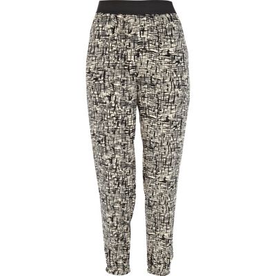 Beige scratch print cuffed hem trousers