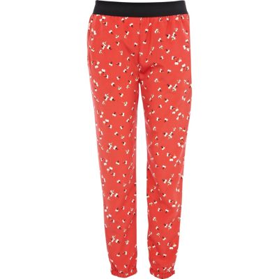Red ditsy flower print cuffed hem trousers