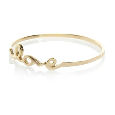 Gold tone love bangle