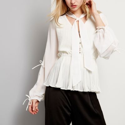 White pleated blouse