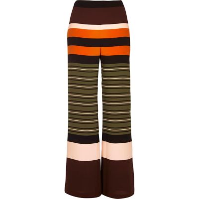 green trousers with side stripe
