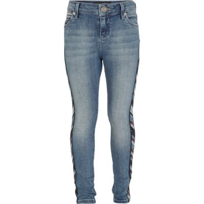 Girls blue mid wash aztec skinny jeans