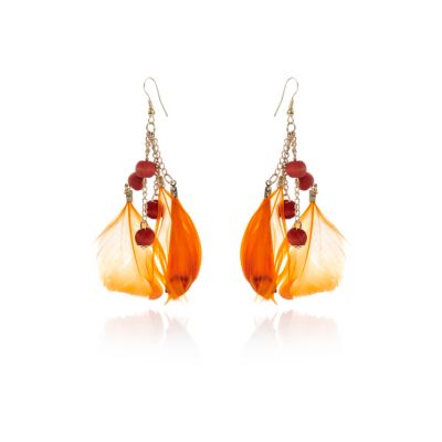 Girls orange feather earrings