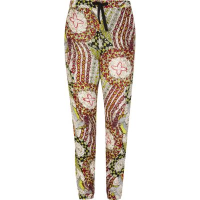Girls green tribal print trousers