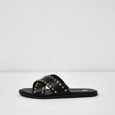 Black cross strap stud sliders - sandals - shoes / boots - women