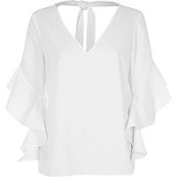 White frill sleeve tie back top