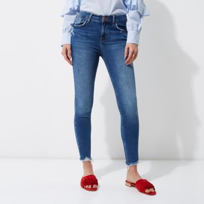 Amelie – Mittelblaue Superskinny Jeans mit Fransensaum