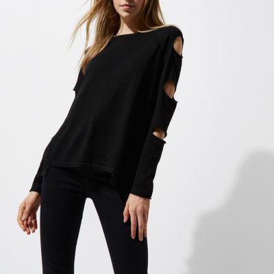 Pull noir à découpes et dos échelle