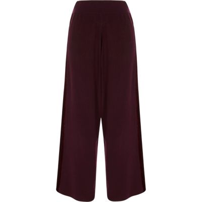 Pantalon large bordeaux avec empiècements en velours
