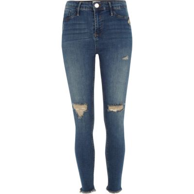 Molly – Mittelblaue Jeggings mit Fransensaum im Used-Look