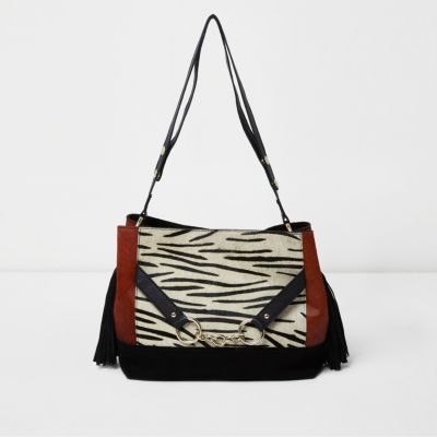 Zwarte suède tas met zebraprint en ponyhaar