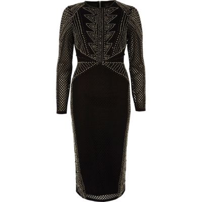 Robe moulante mi-longue en maille noire à ornements