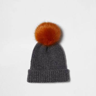 Light grey pom pom beanie hat