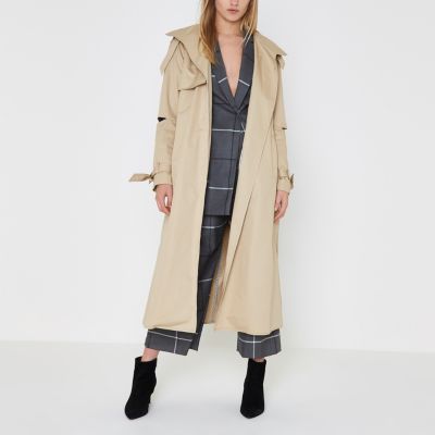 Beige lange trenchcoat met deconstructed mouwen