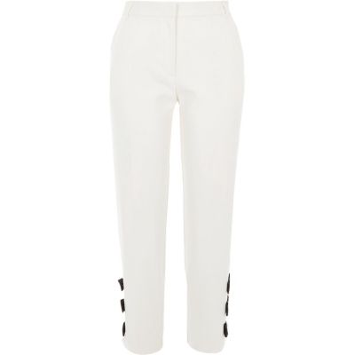 Cream bow hem cigarette trousers