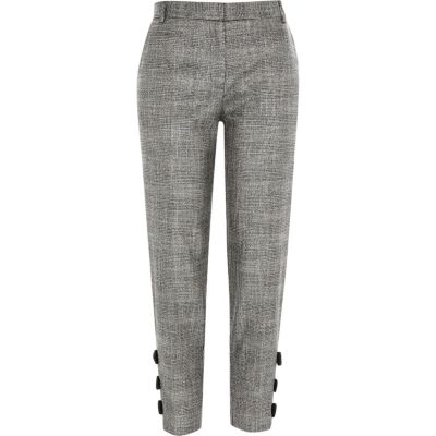 Grijze geruite smaltoelopende broek met strikjes bij de zoom