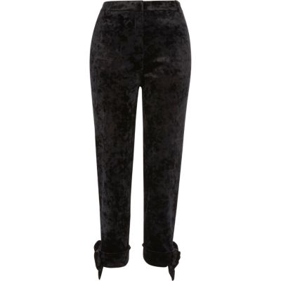 Black crushed velvet bow cigarette trousers