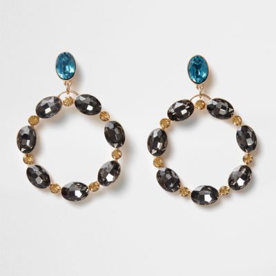 Goudkleurige en topaz oorringen met ovaalvormige siersteentjes