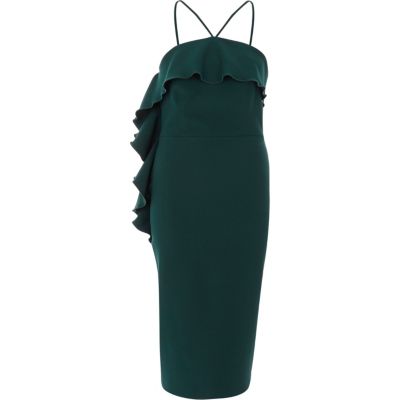 Robe moulante mi-longue verte à dos nu et volant