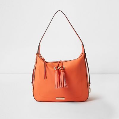 Bright orange tassel tab slouch bag