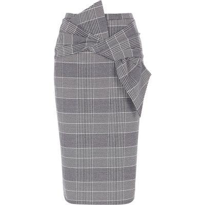 Jupe crayon à carreaux noire avec nœud devant