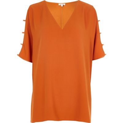 Oranje T-shirt met V-hals en mouwen met uitsnedes