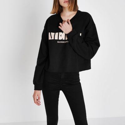 Zwart sweatshirt met 'merci'- en blokprint