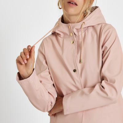 pink hooded rain mac