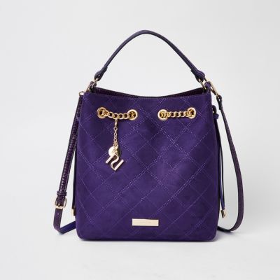 purple quilted handbag