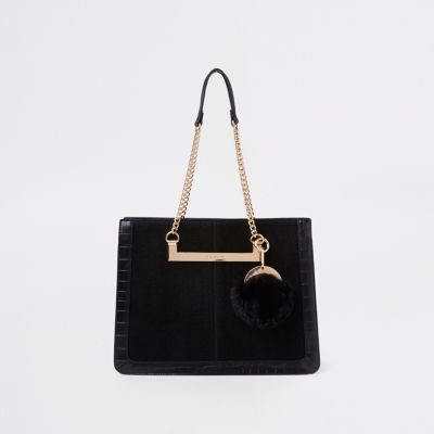 black handbag with chain handle